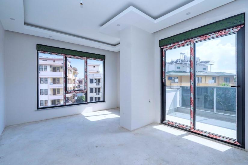 New 2 + 1 apartment in a luxury complex in the center of Alanya - Фото 19