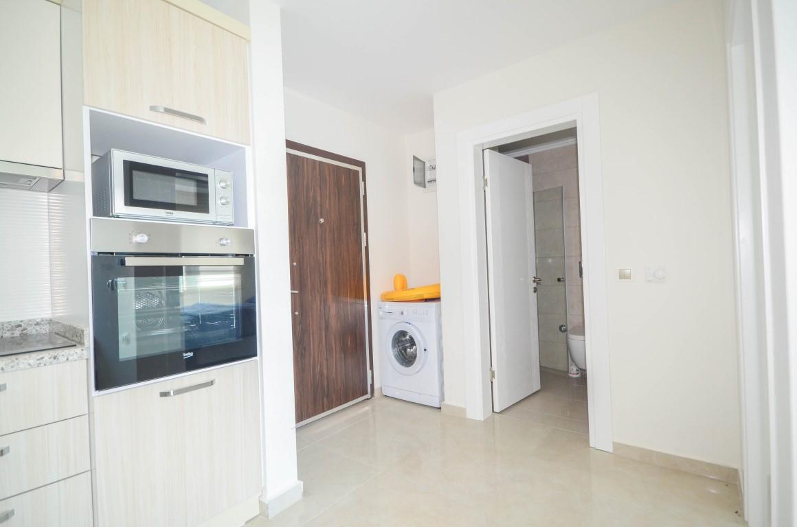 Furnished 1 + 1 apartment in a complex with rich infrastructure in Mahmutlar area - Фото 18