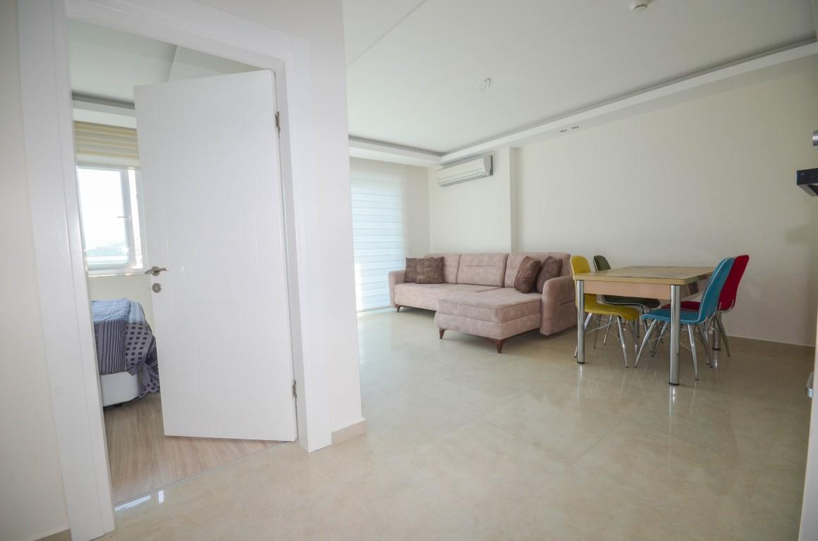 Furnished 1 + 1 apartment in a complex with rich infrastructure in Mahmutlar area - Фото 5