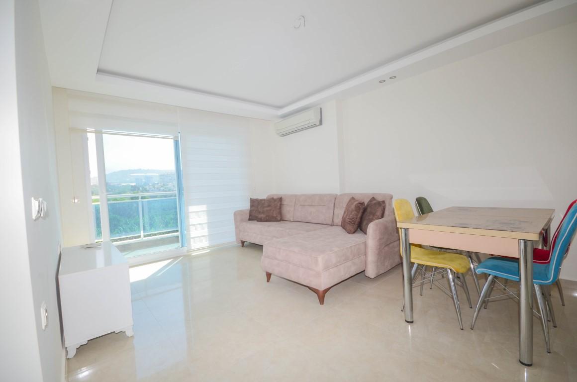 Furnished 1 + 1 apartment in a complex with rich infrastructure in Mahmutlar area - Фото 6