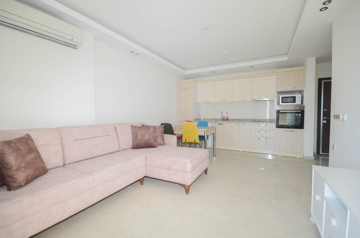 Furnished 1 + 1 apartment in a complex with rich infrastructure in Mahmutlar area - Фото 7