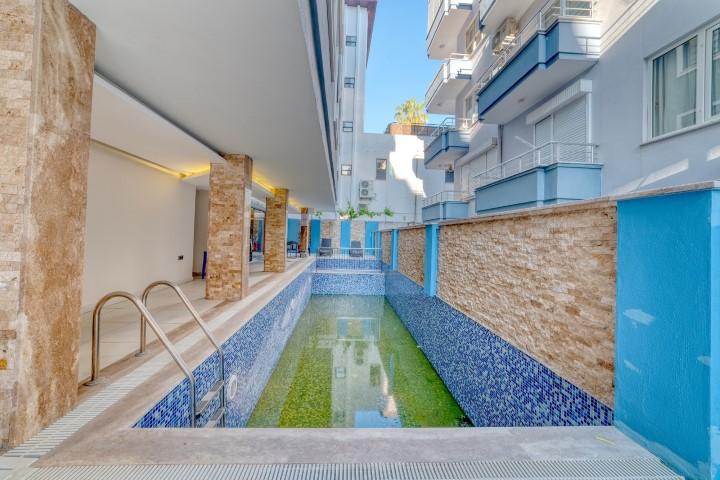 One bedroom apartment of 100 m2 next to the sea in the center of Alanya - Фото 5