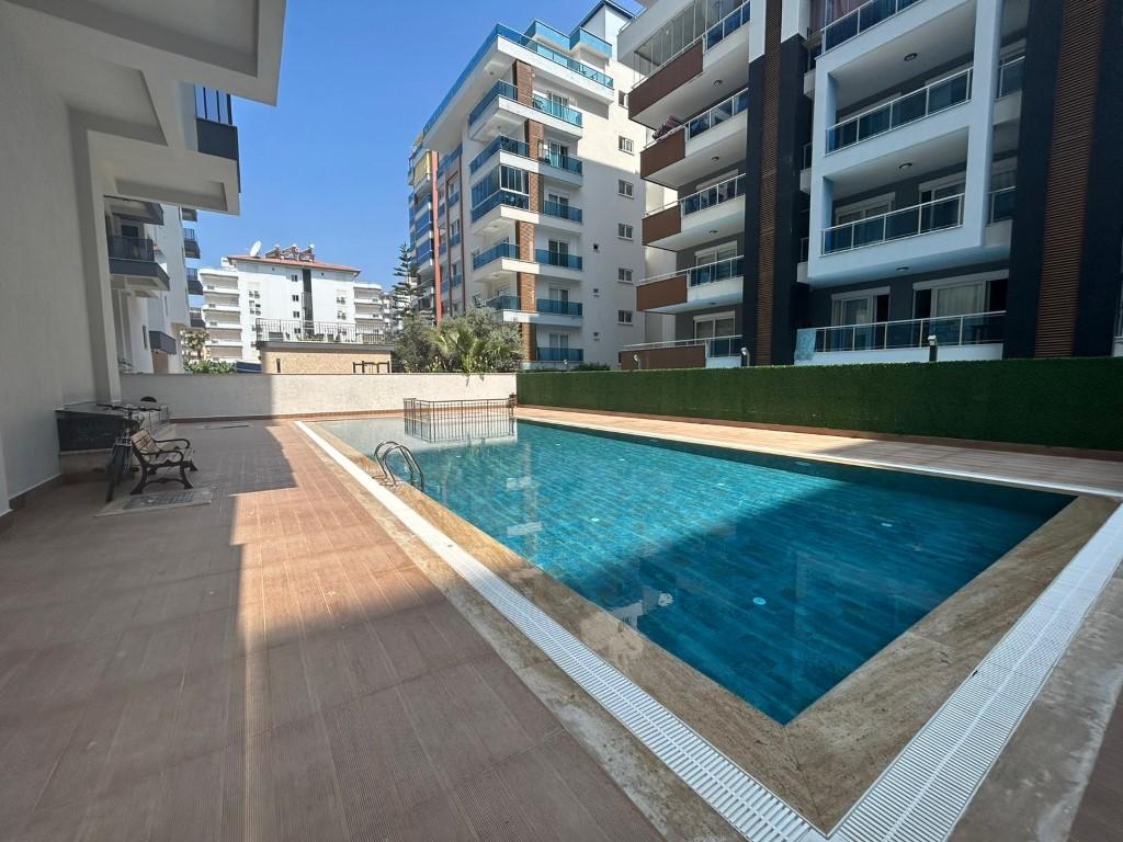 One bedroom apartment in a new house located in the area of Mahmutlar 200 m from the sea - Фото 17