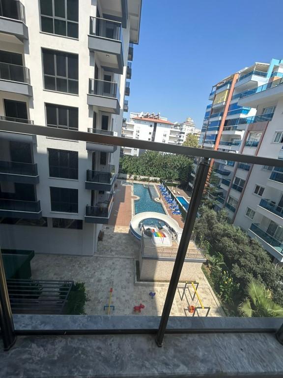 One bedroom apartment in a new house located in the area of Mahmutlar 200 m from the sea - Фото 10