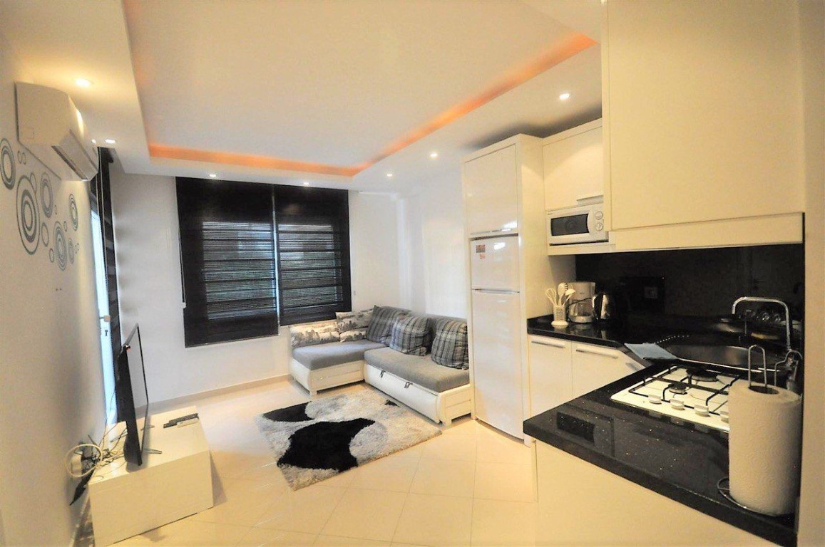 Two-room apartment on the ground floor in the prestigious area of Oba, Alanya - Фото 3