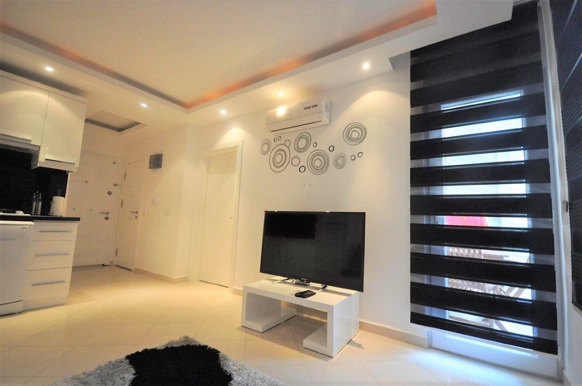 Two-room apartment on the ground floor in the prestigious area of Oba, Alanya - Фото 2